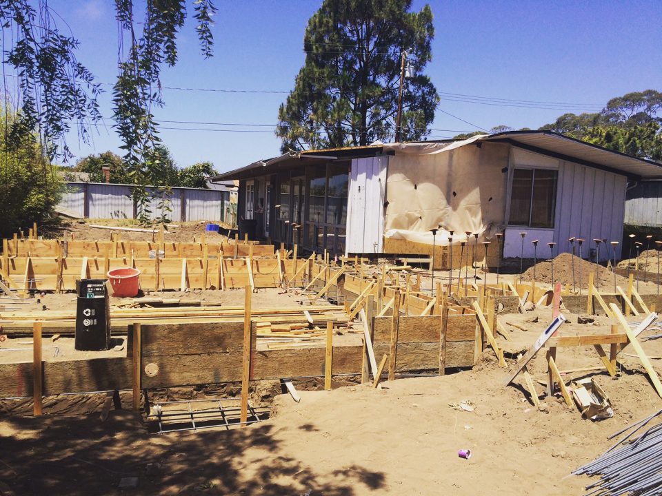 beach house foundation and existing house